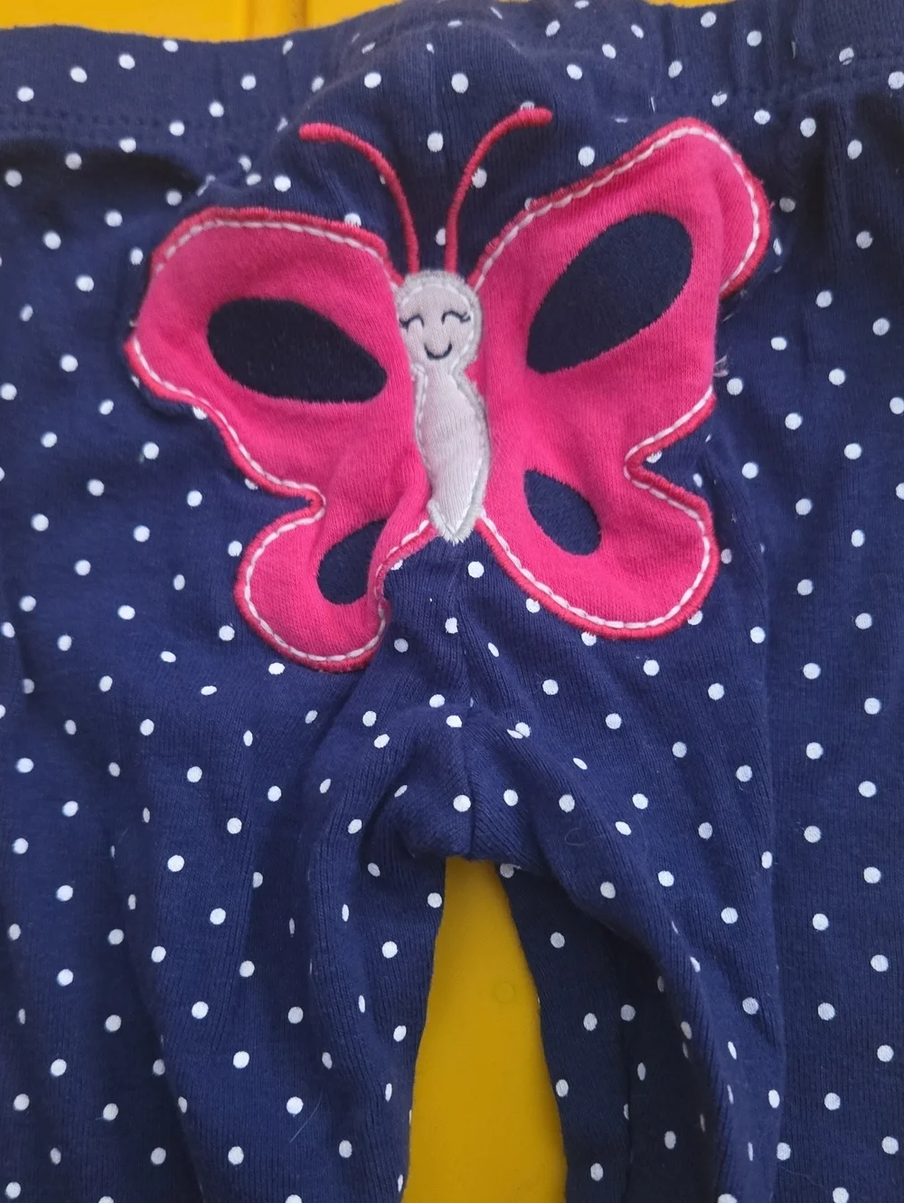 Carter's Onesie with polka dots and matching leggings.